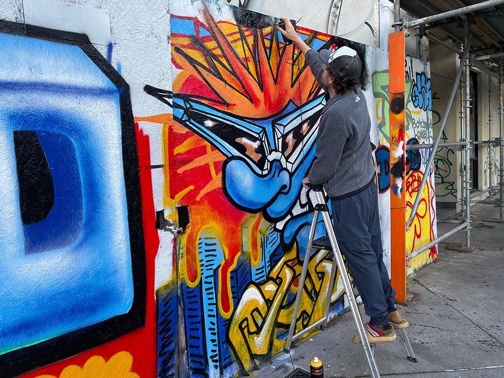 Gary at work on a mural